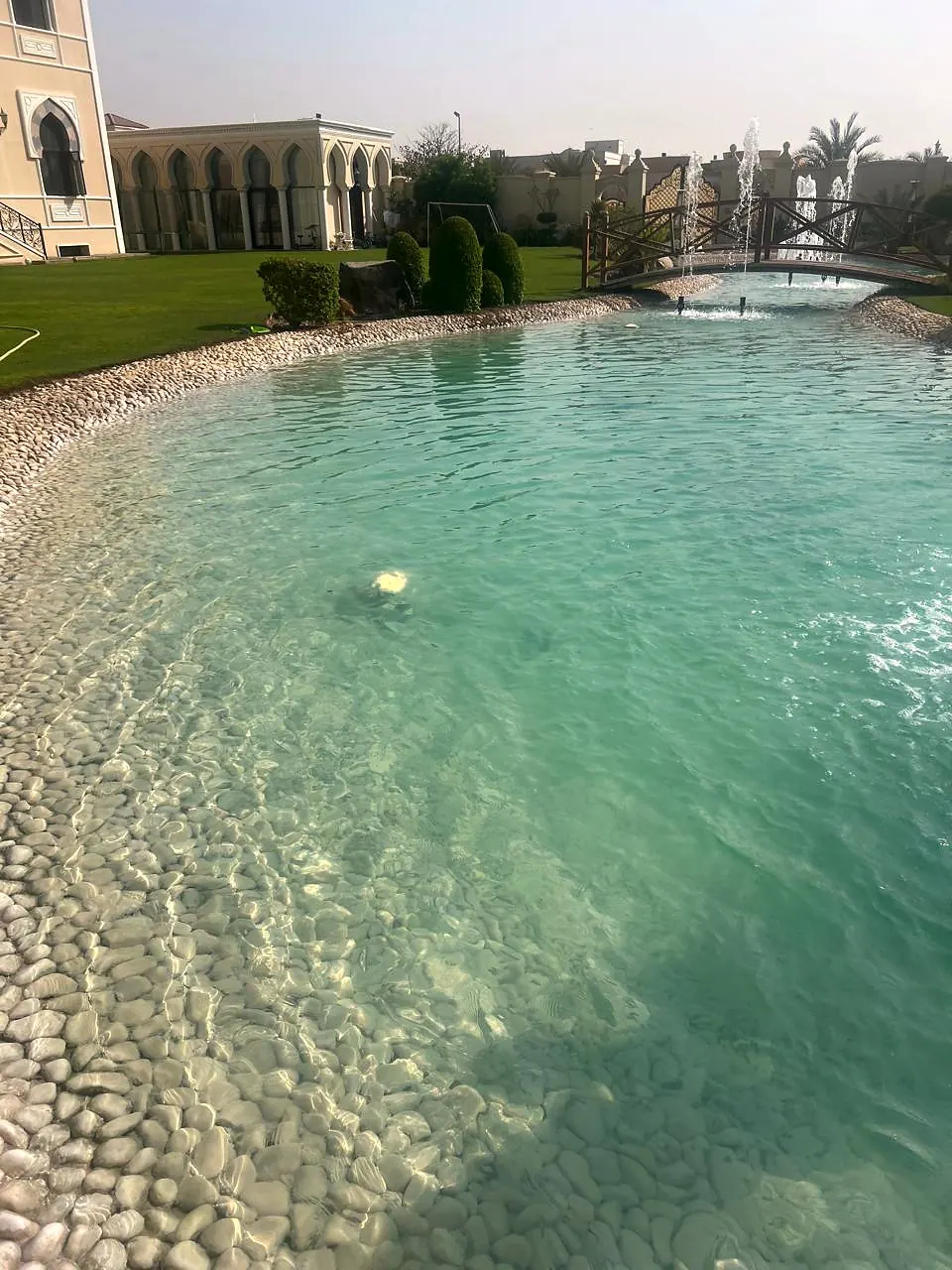Naturalistic lake edge with pebble finish