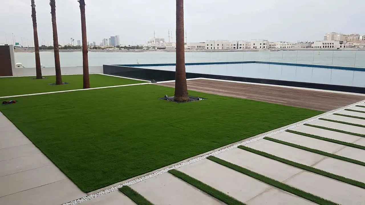Waterfront lawn, palms and stepping-stone path